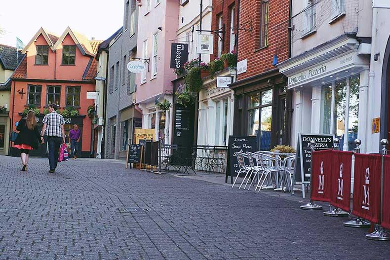 Couple walking down the street looking at shops