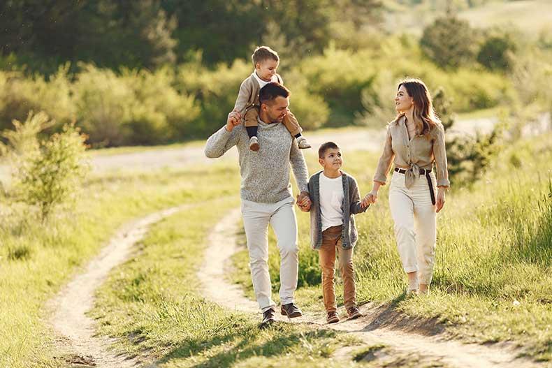 Family playing in a field together